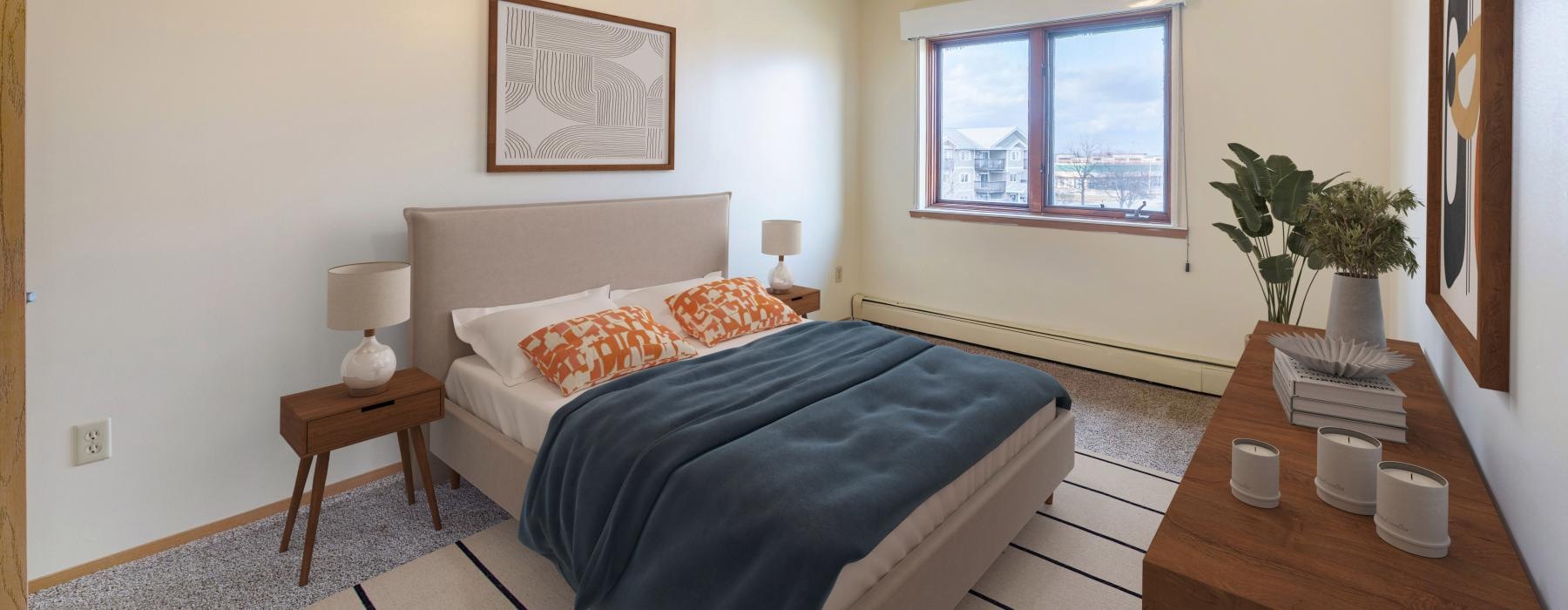 a bedroom with a bed and a fan